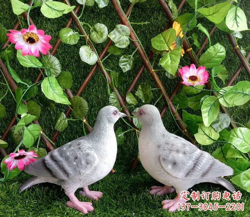 上海雕塑小女孩一只手拿书一手和平鸽