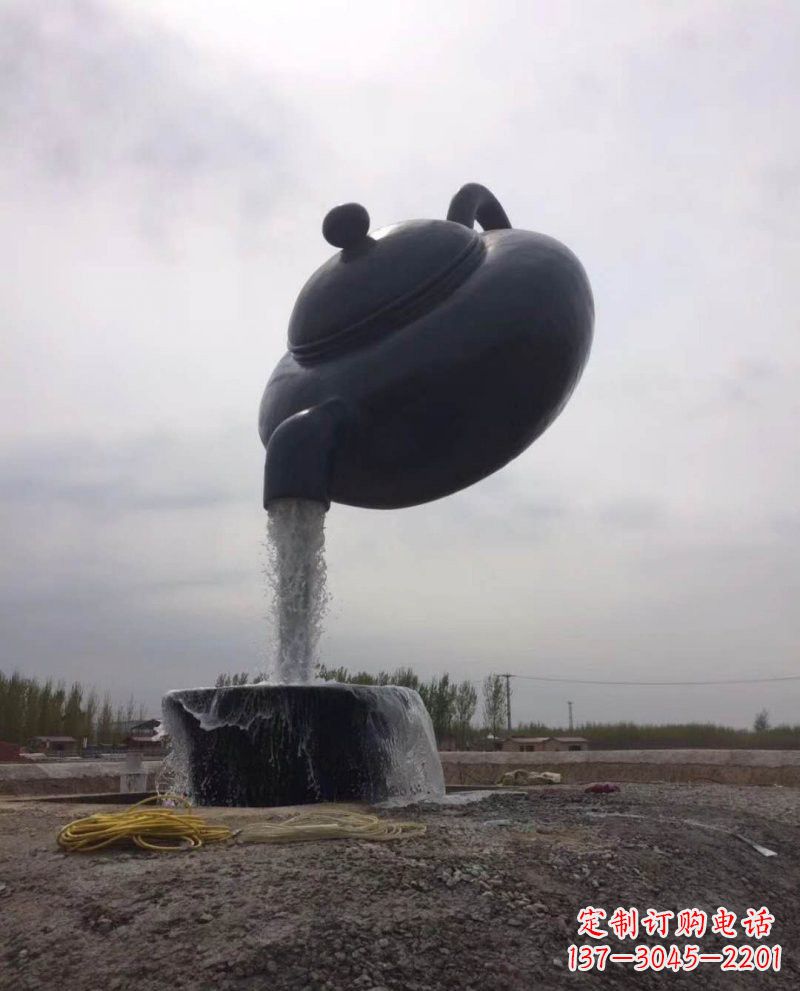 上海新疆流水的茶壶铜雕